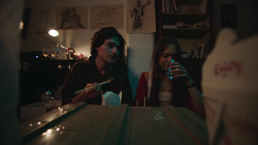 Couple eating and drinking in an indoor space