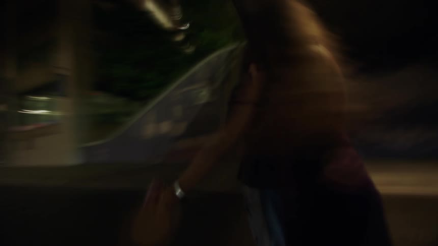 The couple dance in the street at night
