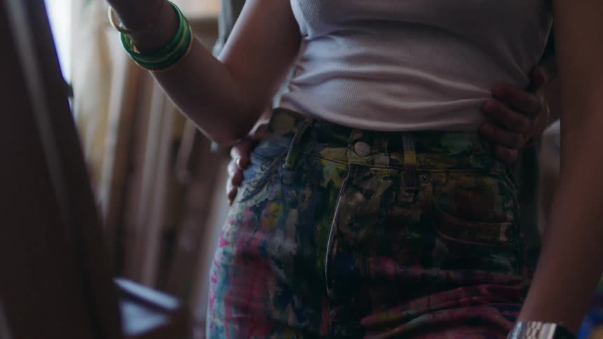 Pair of hands on a womans waist