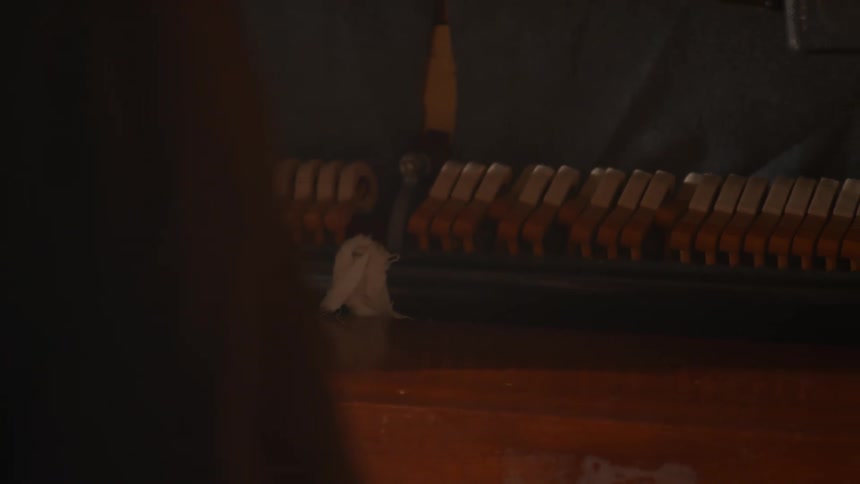Closeup of hands playing piano keys