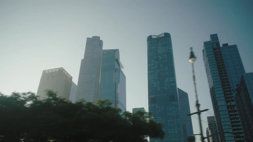 Metropolises with modern skyscrapers against a clear blue sky