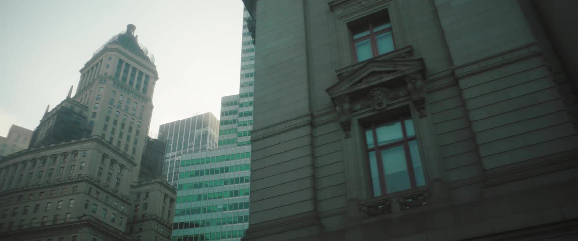 A view of modern highrise buildings surrounded by classic architecture in a cityscape