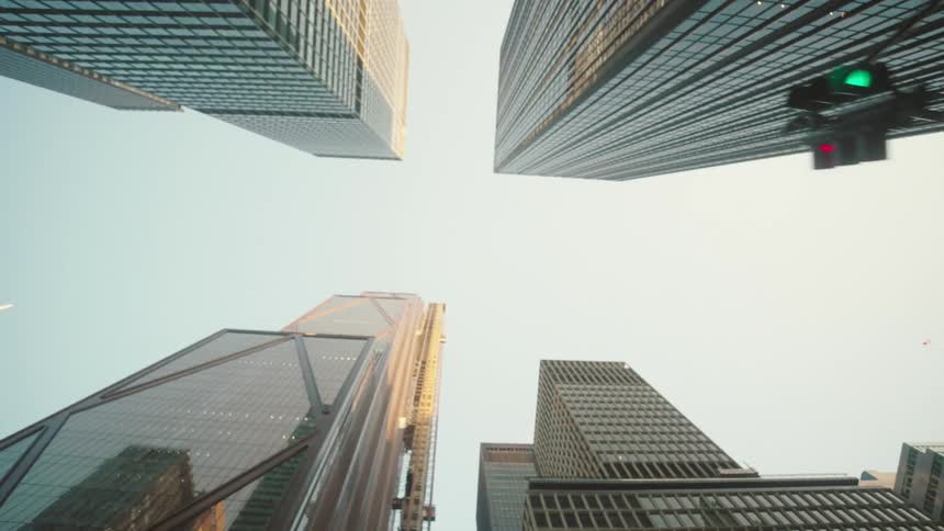 Several skyscrapers in the center of a city seen from the ground