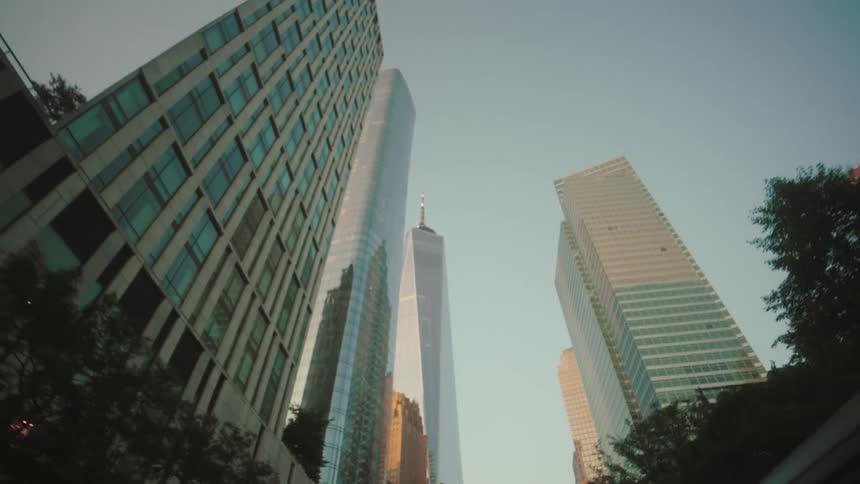 Tall buildings fill the clear sky