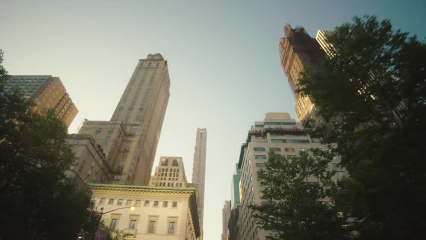 Urban city with residential and commercial buildings seen on a blue sky morning