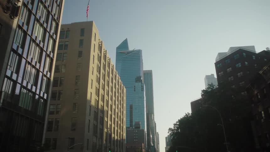 Tall buildings in a metropolitan city street outdoors during daytime
