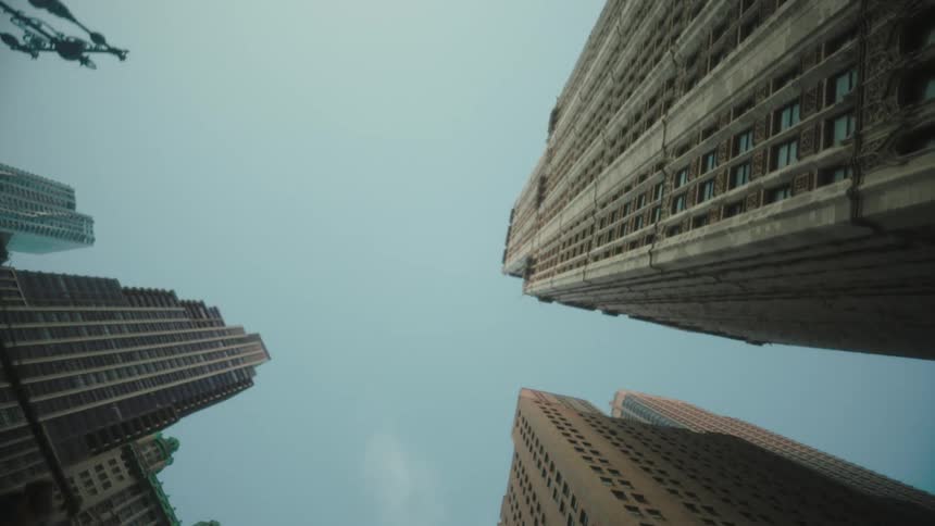 High rise buildings in a metropolitan city street outdoors during daytime