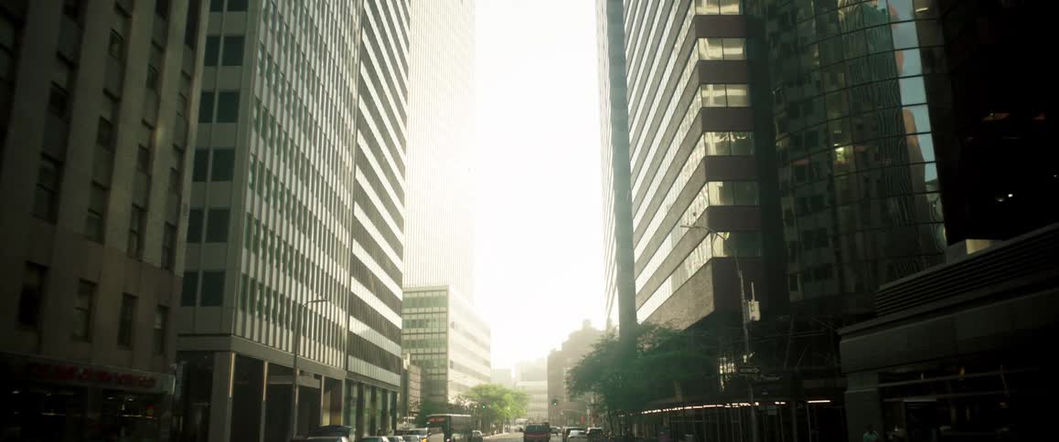 Urban road of a metropolis with tall buildings and vehicle traffic