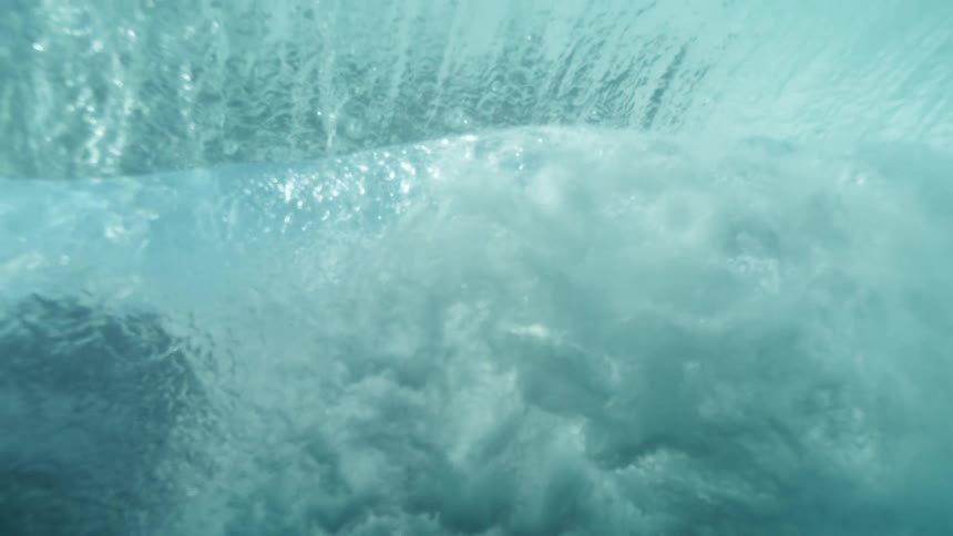 A calm underwater scene shows deep blue currents and a gentle gradient of light