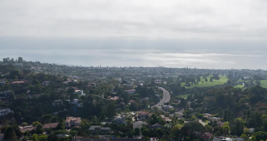 Golf course on the outskirts of a suburb with the metropolis in the distance