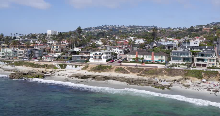 Panorama of an urban seaside city with mountains in the background