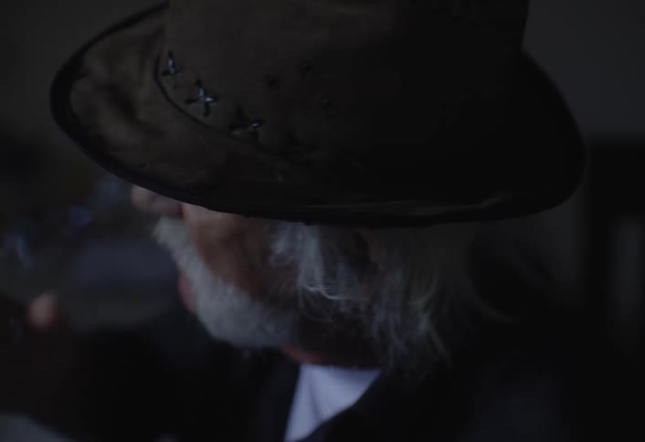 Man in hat smoking