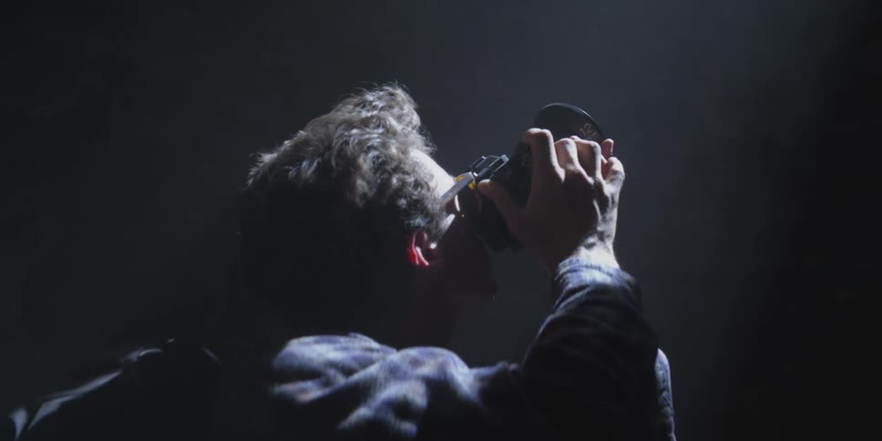 A man takes a photo with his camera