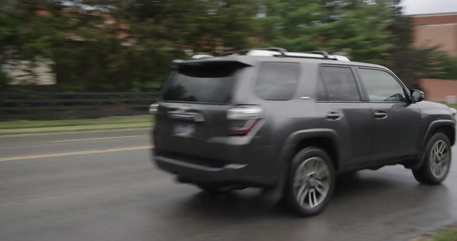 The vehicle drives on the wet road