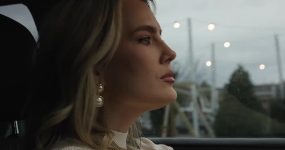 Blonde woman focused on driving