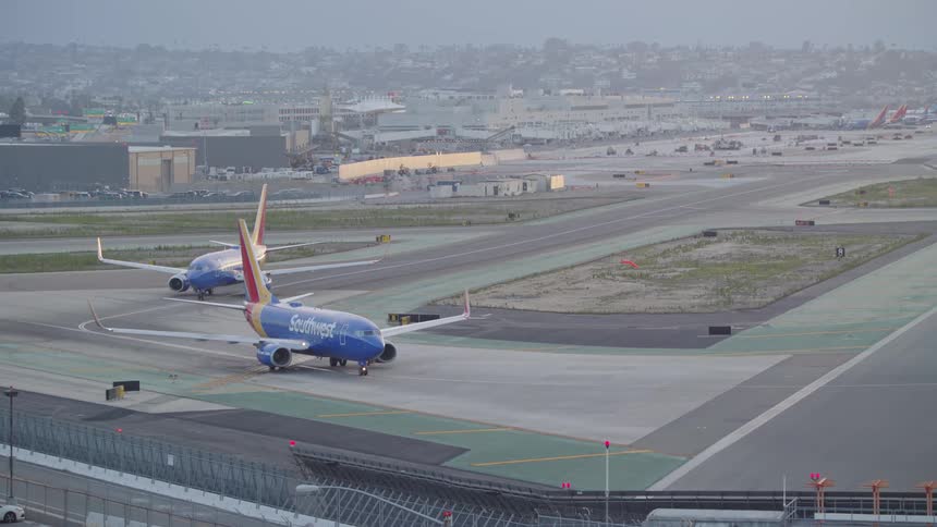 Southwest airplane taxing towards the runway at an airport