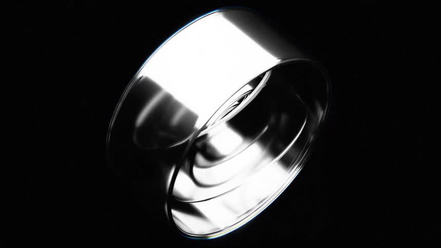 The video displays a dynamically animated abstract object maybe logo composed of twisting and coiling metallic ribbons against a black background the ribbons reflect light creating a sense of movement and depth as they intertwine