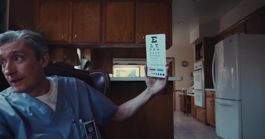Healthcare professional sitting and presenting a pamphlet