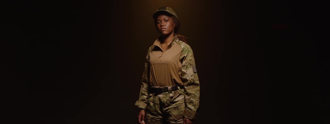 A model is wearing military clothing