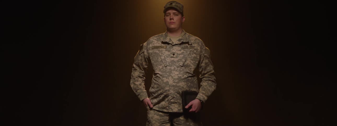The officer is posing and slowly spinning