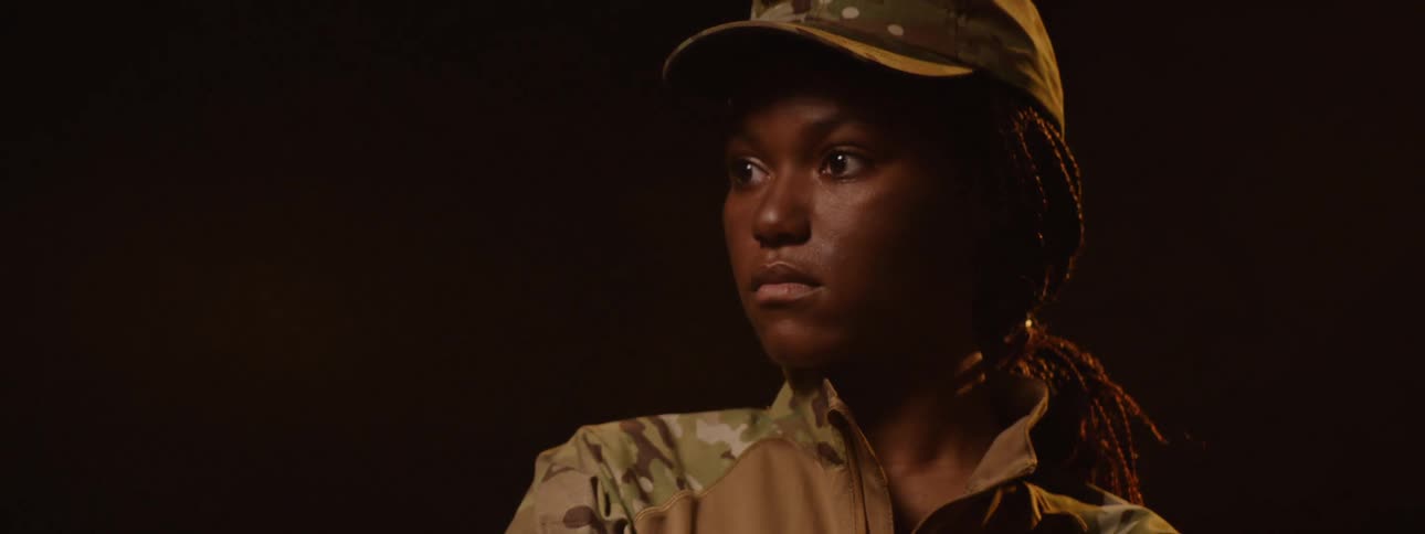 The lights slowly dim on the soldier