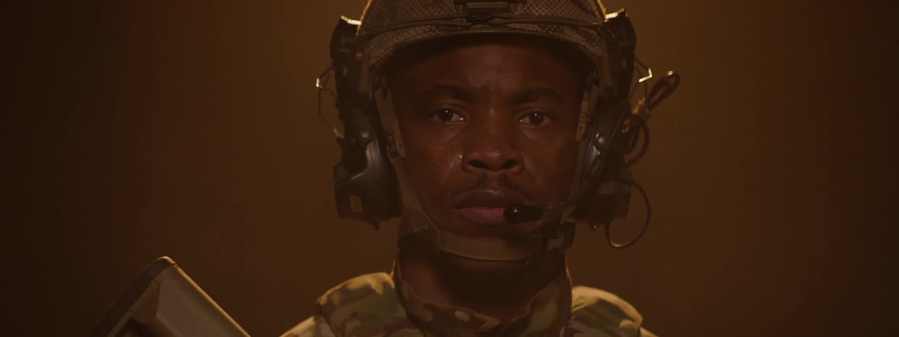 The soldier is slowly spinning under the lights