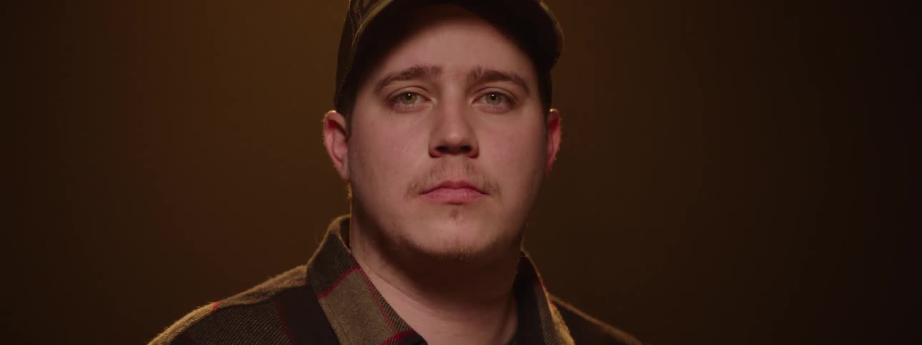 Portrait of a man wearing a cap in a studio lighting environment