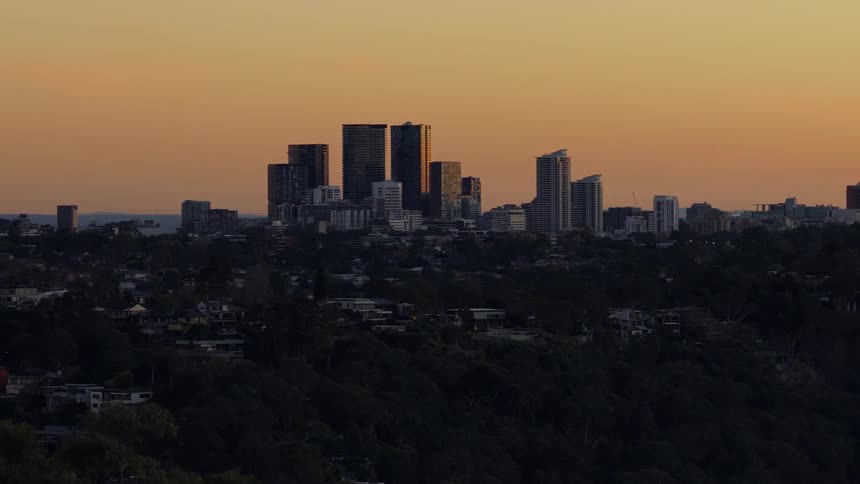 Homes are on the hills before the city