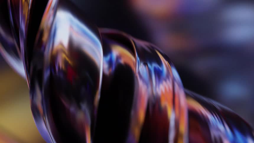 Thin metallic strips coil around each other while reflecting the colorful surroundings