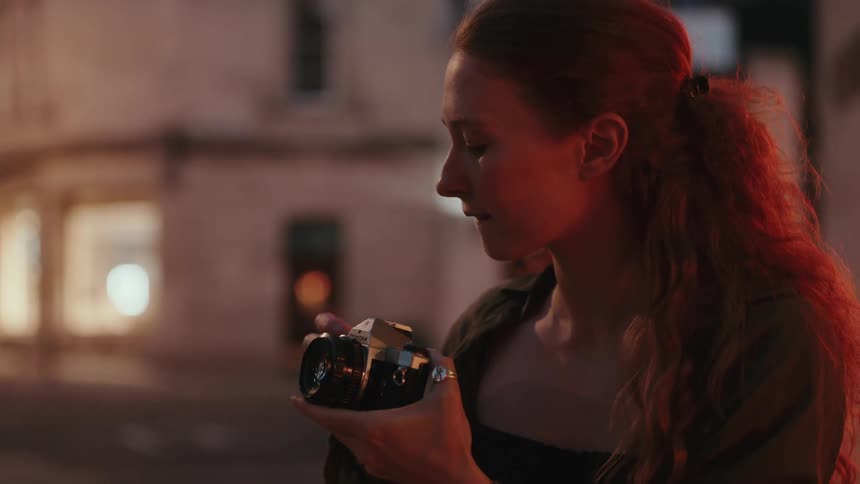 Woman in an urban environment taking pictures