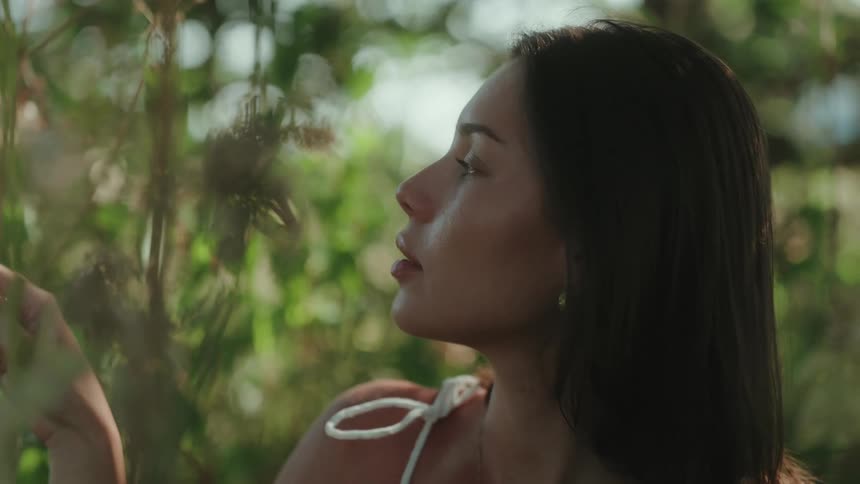 A young woman relaxes in nature