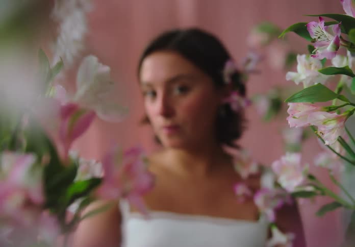 A woman is wearing a wedding dress