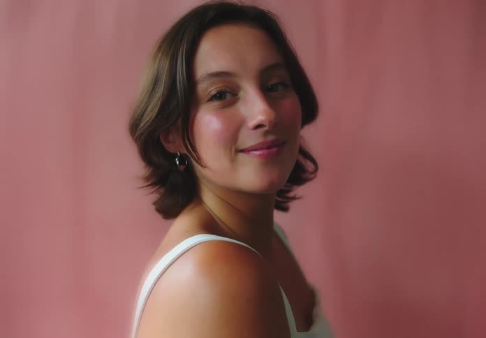 Woman poses to camera with a smile