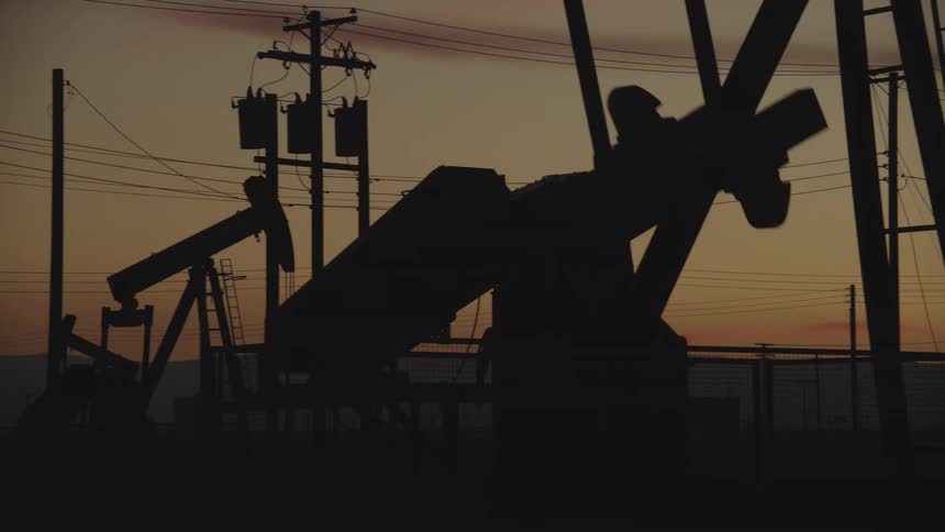 Flames shoot up from the pipe in the oil field