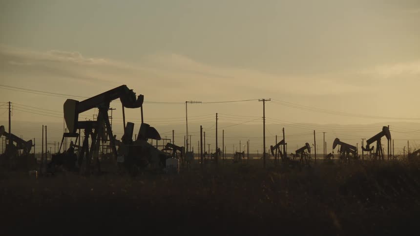 The sun is rising on the large oil field