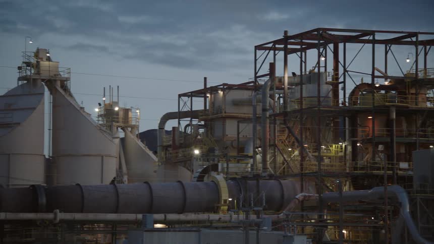 Wide shot of an industrial facility or plant likely a refinery or processing plant