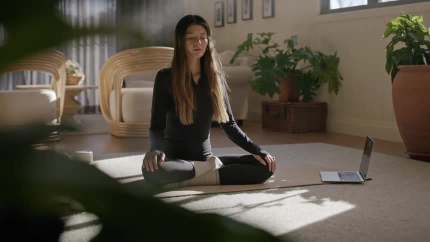 A woman begins to meditate