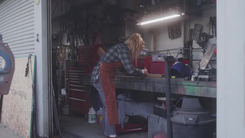 Woman working inside a workshop