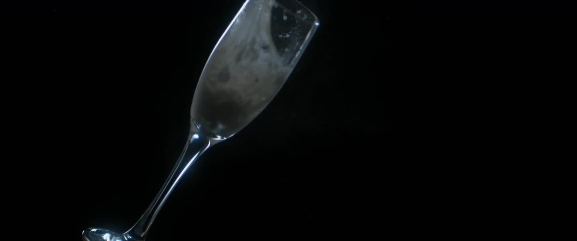 A glass of liquid falling over