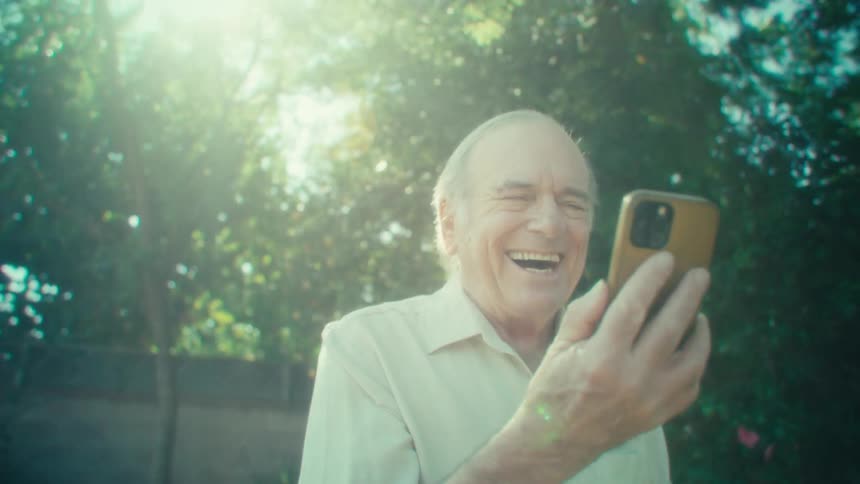 The man walks and talks on his cell phone