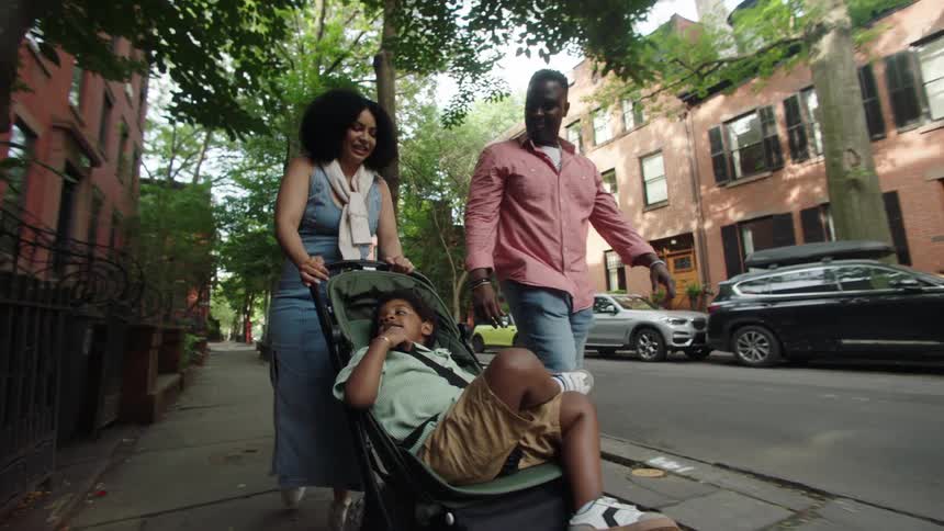 Family walking on a suburban sidewalk