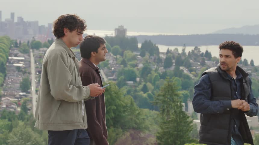 Three friends outdoors walking talking to each other
