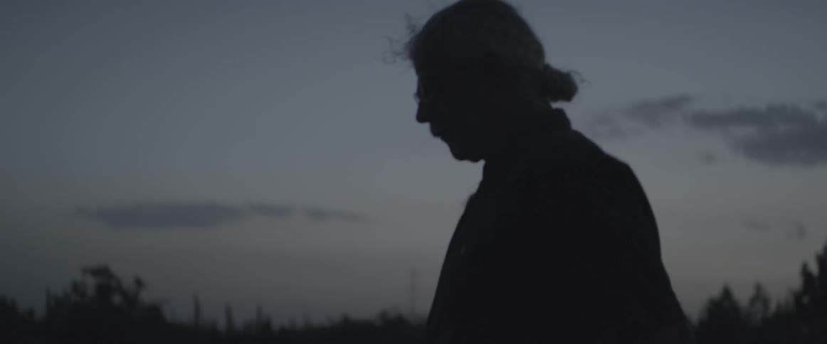 Man standing outside at dusk