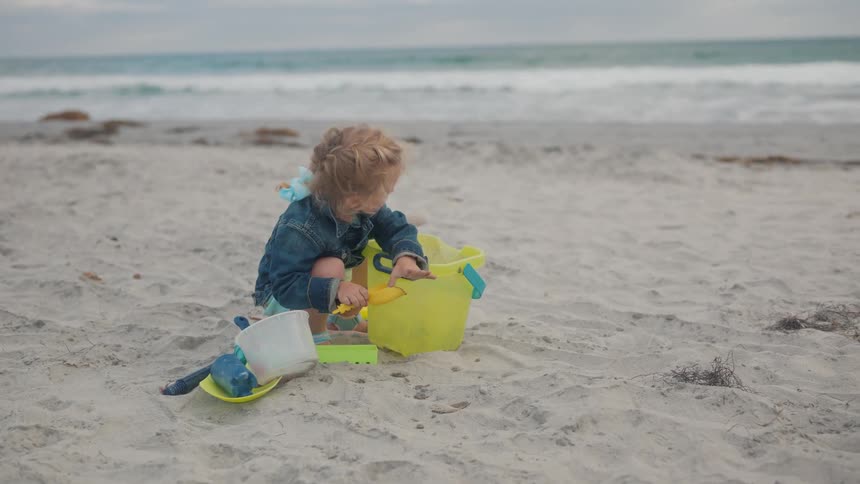 A clip of a kid playing at the beach