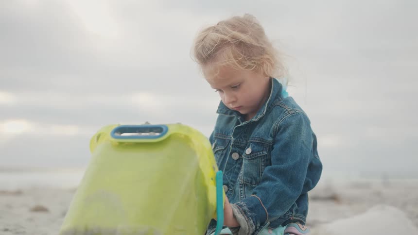 A footage of a kid playing at the beach