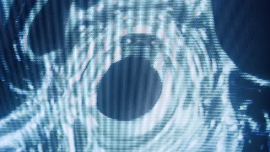Screen displaying a circle spreading and disappearing again with other shapes