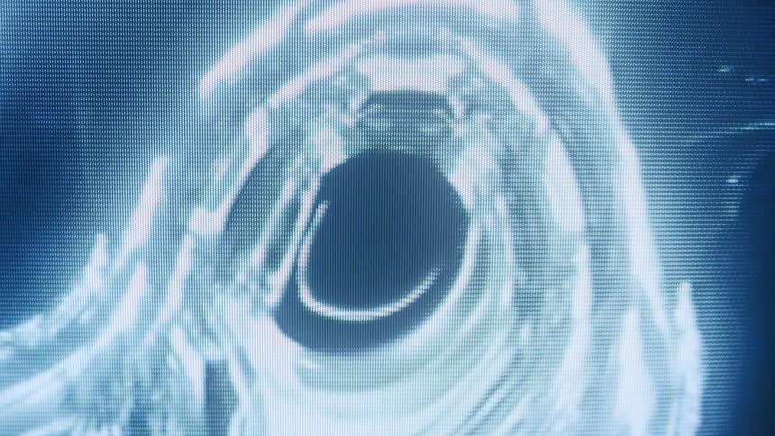 Liquid body against a black background in abstract motion