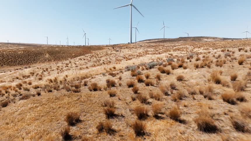 Windmills are working on the large wind farm