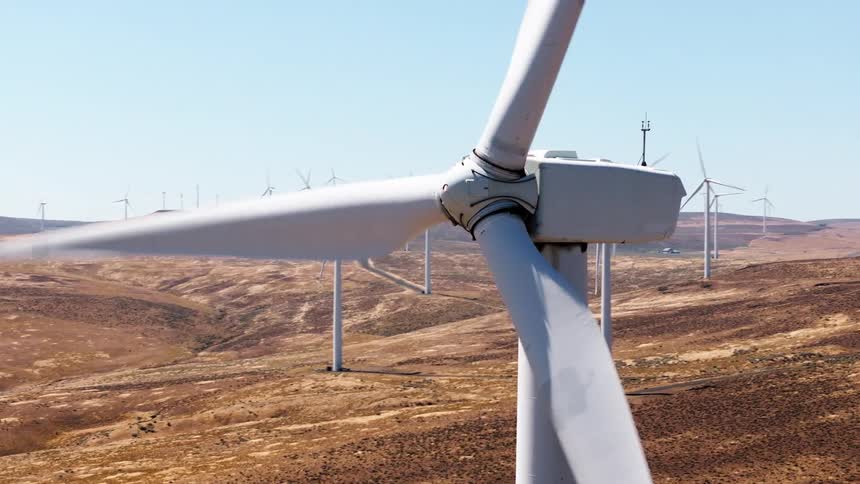 The large windmills slowly turn