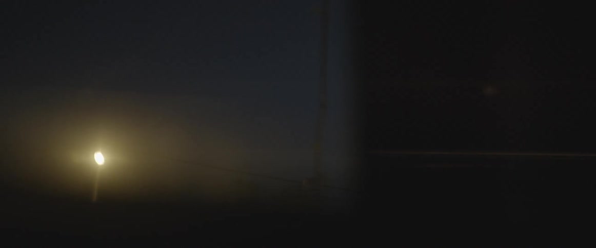 A street lamp is seen shining from a vehicle window
